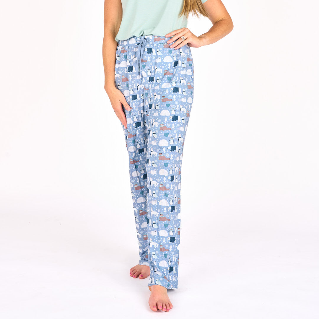 Model standing in white background with polar pals pajamas featuring polar bears