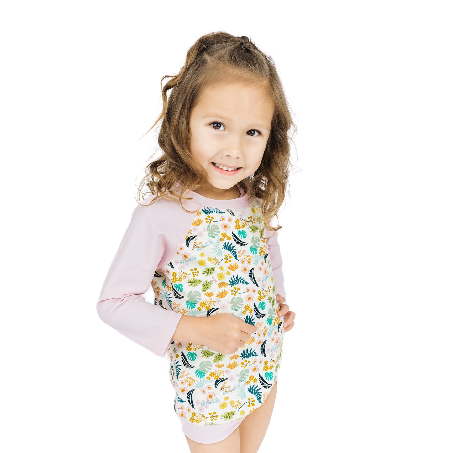 Side view of the Tropical Blooms rash guard shirt, illustrating the comfortable fit for swimming, running, and beach play.