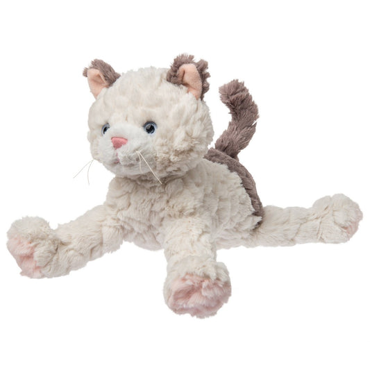 fluffy stuffed kitty thats white with brown on its ears and tail and blue eyes