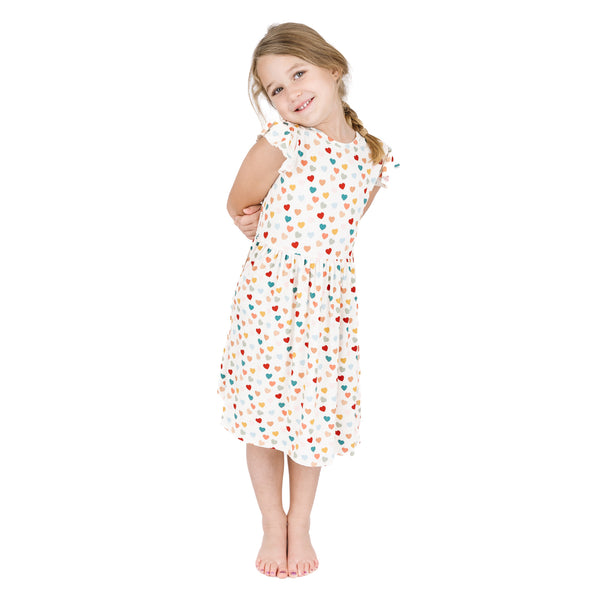 Child wearing Rainbow Hearts bamboo short sleeve twirl dress.