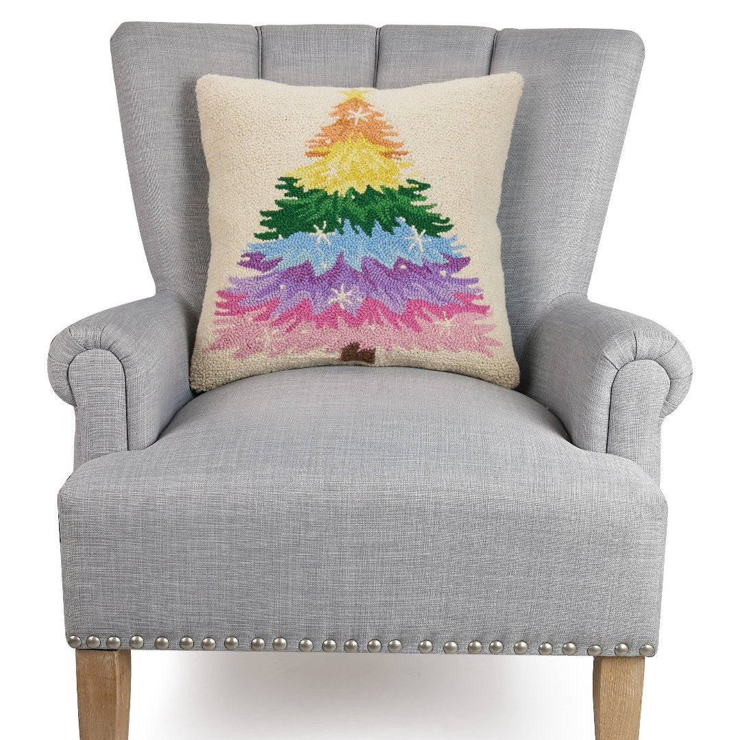 Pillow with rainbow colored Christmas tree.