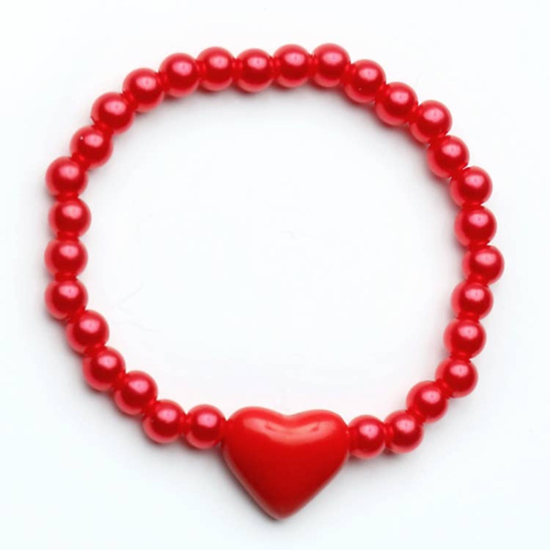 red beaded bracelet with a red heart bead on it