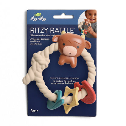 baby rattle with a highland cow on the top