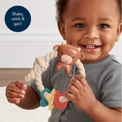 baby rattle with a highland cow on the top