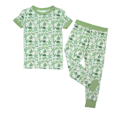 Save the Sea Turtles bamboo short sleeve kids pajama pants set by Emerson and Friends. This ultra-soft, eco-friendly pajama set features an adorable sea turtle and ocean-inspired print, perfect for little nature lovers. Designed for all-night comfort with breathable bamboo fabric.