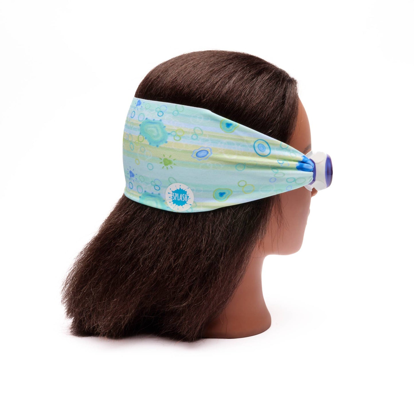 Mannequin head with a blue patterned headband and goggles on a white background• Splash Place sea glass swim goggles with blue and green fabric strap
• No tangle fabric strap swim goggles with blue tinted lenses and white frame