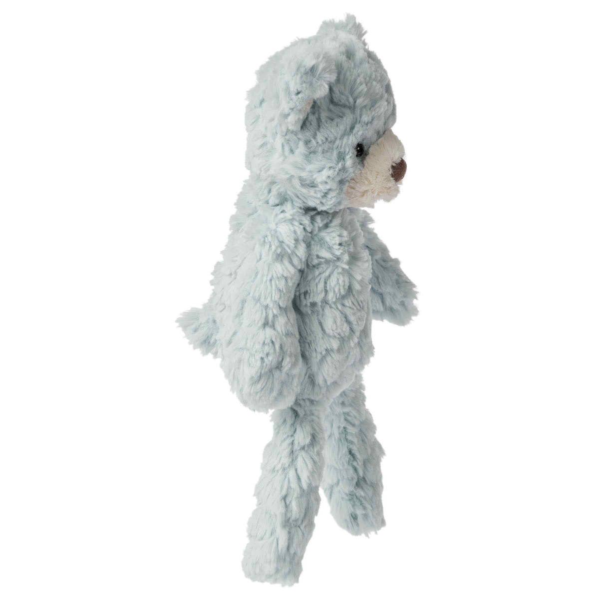 Plush toy resembling a bear with a textured gray fur on a white background