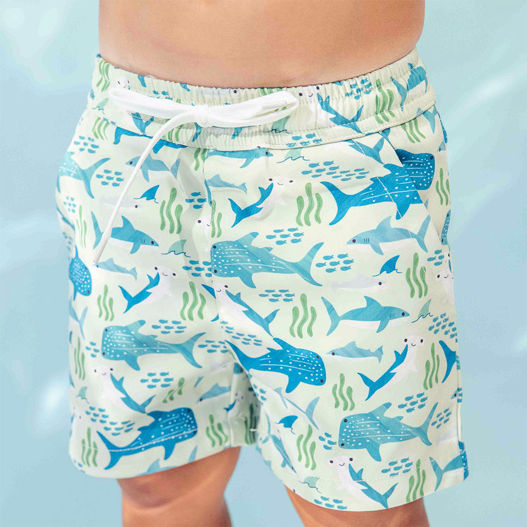 Detailed shot of the Shark Friends Boys Swim Trunks. 