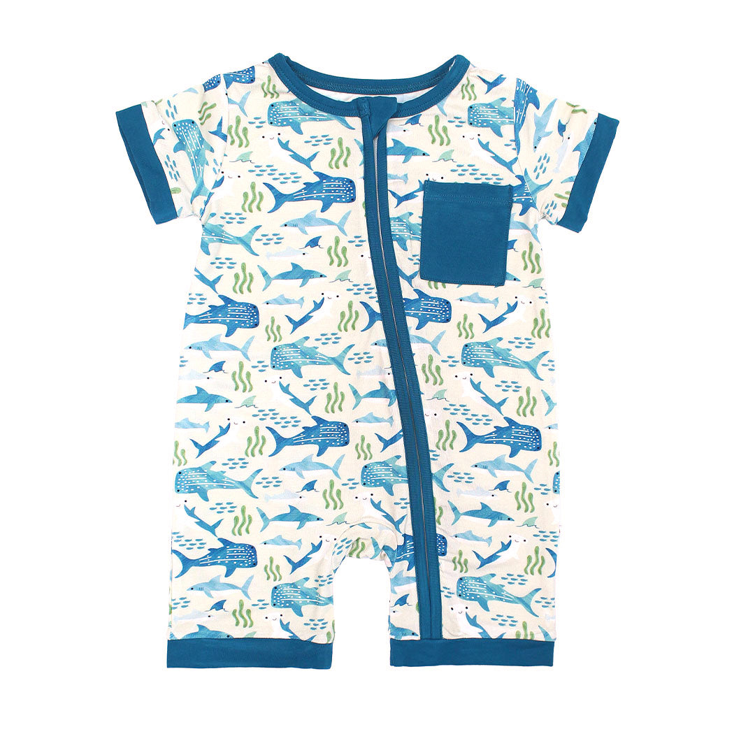 Flay lay image of Shark Friends shortie romper. The print features schools of fish, seaweed, and different types of sharks.