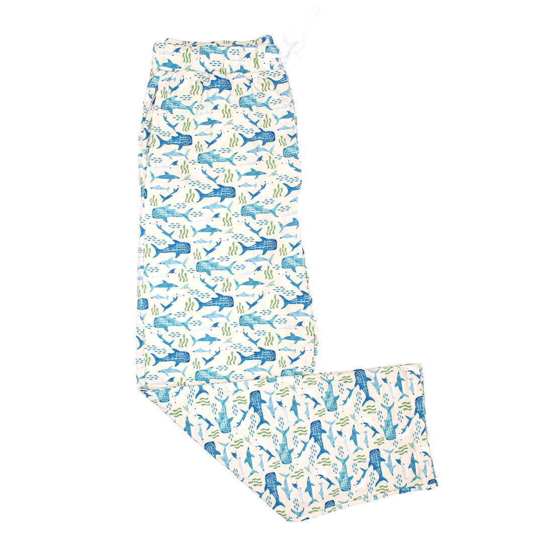 Flat lay image of the Shark Friends Bamboo Relaxed Lounge Pajama Pants. The print features schools of fish, seaweed, and different types of sharks.