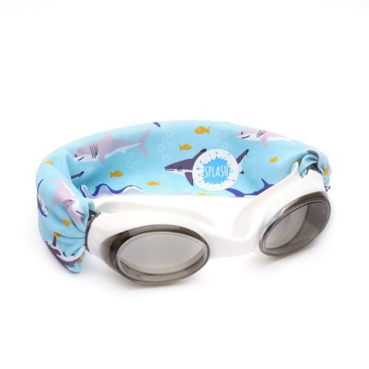 White swim goggles with a blue shark scene strap
