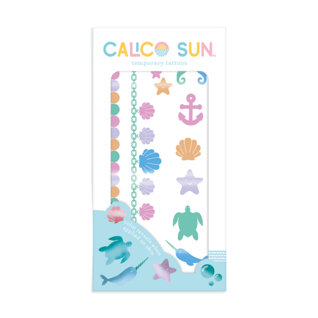 temporary tattoos with beach theme and change color when applied to your skin