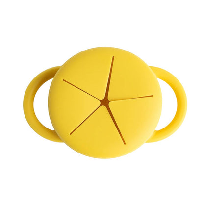 Yellow silicone snacker cup with handles on a white background