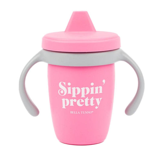 pink sippy cup that says sippin' pretty on it