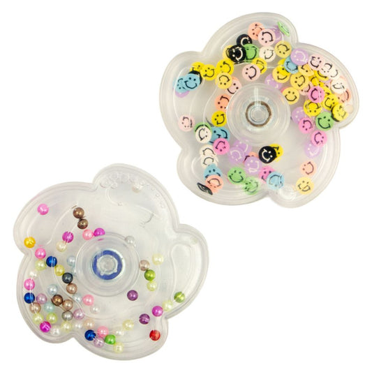 2 different fidget spinners, one with colorful beads inside and the other with colorful smiley faces