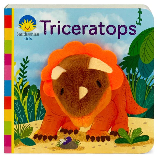 Orange triceratops finger puppet on a multi-colored board book with green jungle leaves