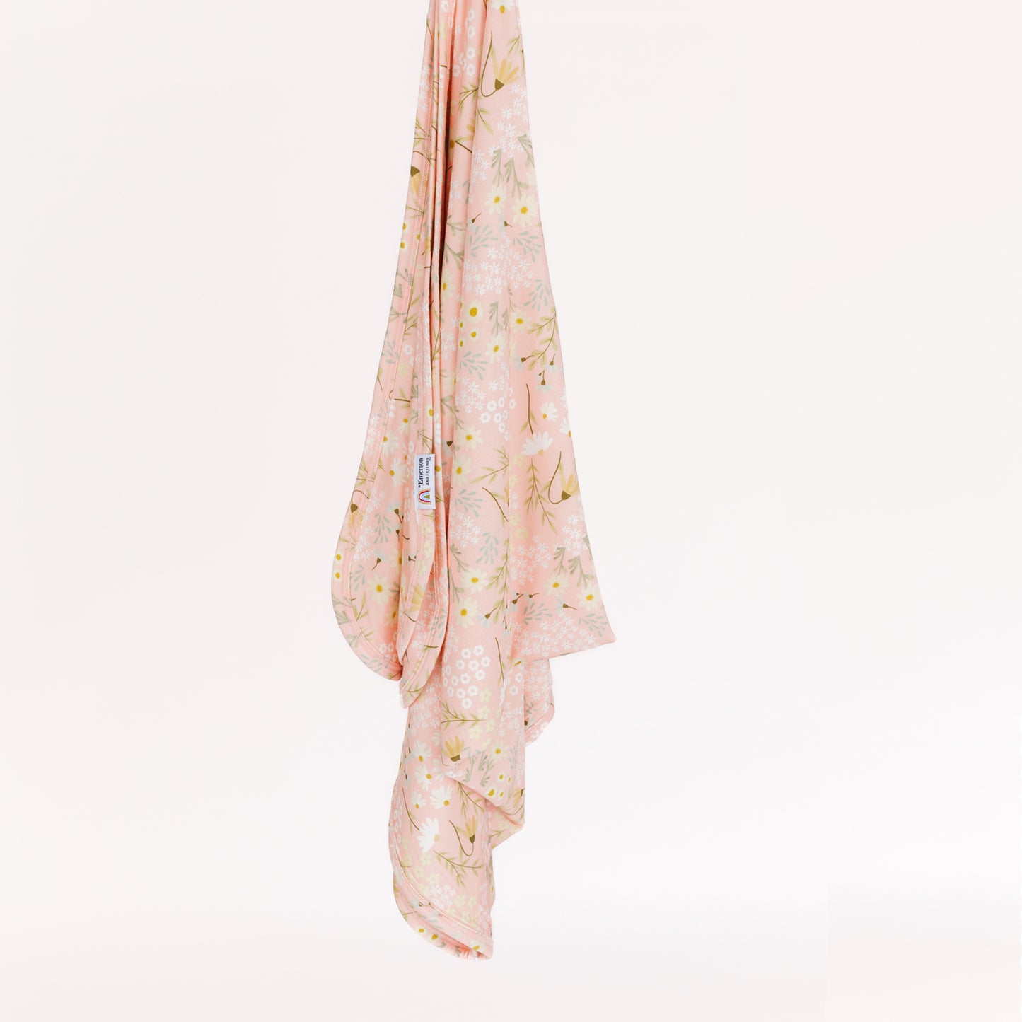 Pink floral bamboo blanket on a white background