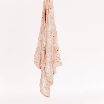 Pink floral bamboo blanket on a white background