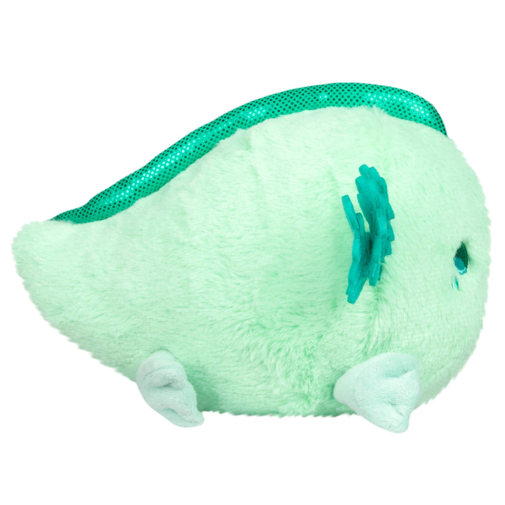 Green plush toy with a flower on a white background