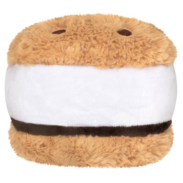 Plush toy resembling a s'more with brown top and bottom and white middle on a white background
