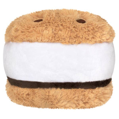 Plush toy resembling a s'more with brown top and bottom and white middle on a white background