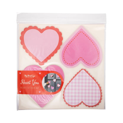 Heart-shaped pink and red items in a package with a visible brand label on a white background.