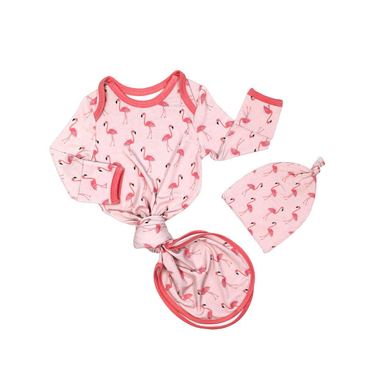 the "fancy flamingos" gown and hat matching set. the "fancy flamingos" print is a pattern of multiple pink flamingoes scattered around the print. 