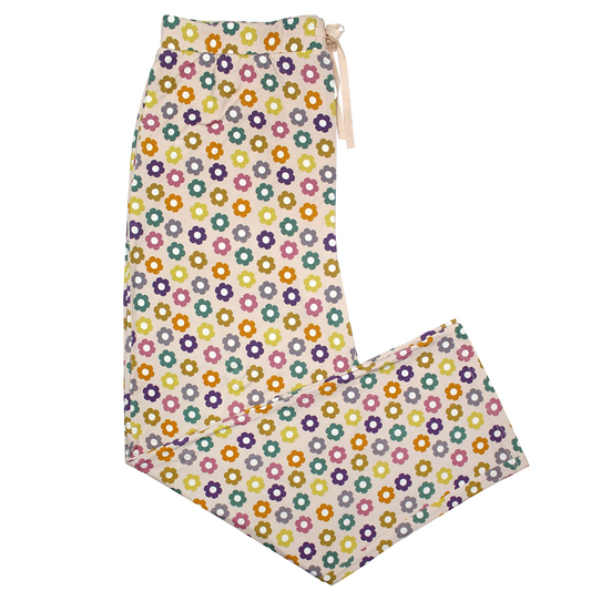 the "feeling groovy" relaxed pants. the "feeling groovy" print is a flowered print in multiple colors. these flowers are retro and groovy. the background is light pink. 
