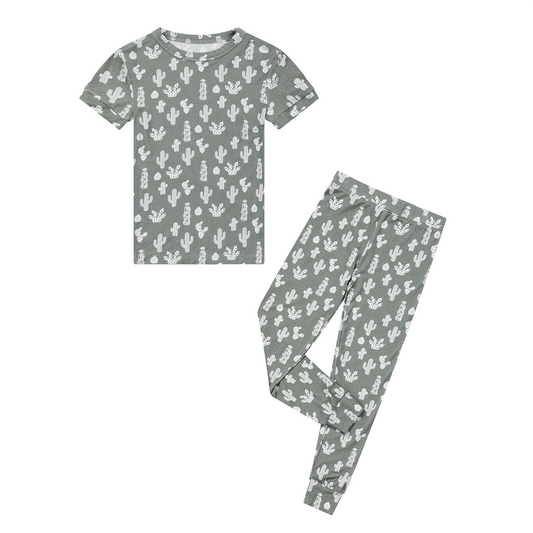 the "stay sharp" 2-piece matching pajama set. the "stay sharp" print is a variety of different white cacti on a greyish/green background. 