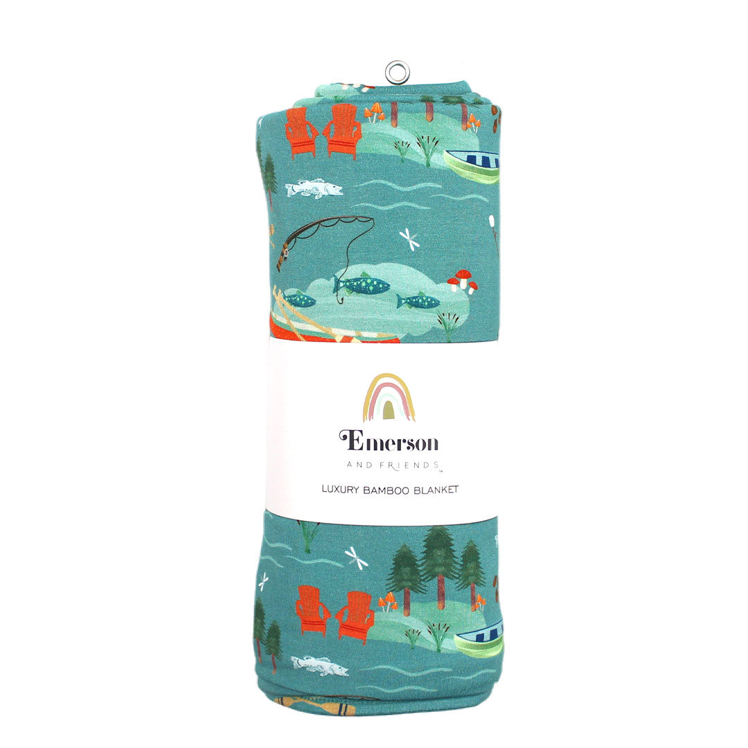 the "jump in the lake" blanket in the emerson and friends wrapping. the "jump in the lake" pattern is a print to capture the day in the life on a lake. you can fine fishing poles, tents, camp fires, adirondack chairs, marsh mellows, ores, canoes, forest trees, and different types of fish and fishing gear.