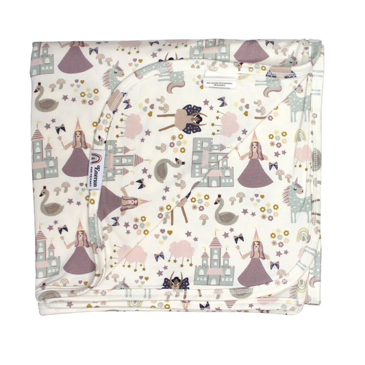 the "once upon a time" bamboo blanket. the "once upon a time" print is a mix of pinks, purples, whites, blues, and yellows. you can see fairy princess and regular princess, unicorns, swans, and castles. theres also hearts, stars and sparkles scattered around the print. 