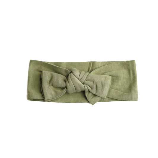 the "olive green" baby bamboo headband. this is a child's headband with a bow on the top. 