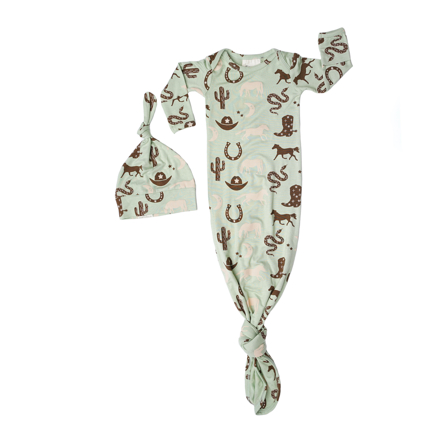 the "giddy up" gown and hat set. the "giddy up" print is a western look at horses, cowboy hats, boots, horse rings, cacti, moons and stars. colors on this print include green, brown, and white. 