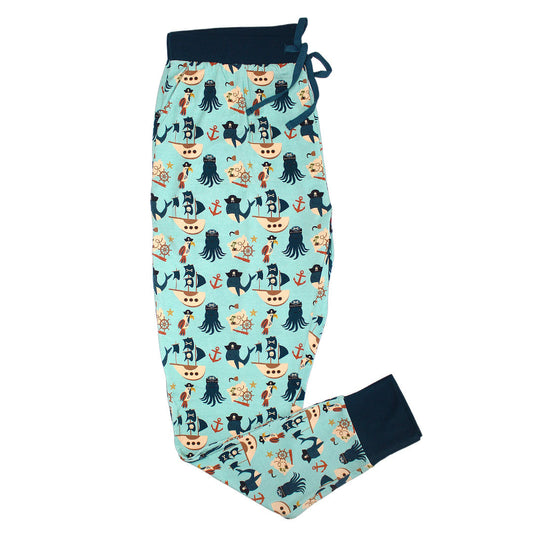 the "pirate's life" women's jogger pants. the "pirate's life" print is a mix of octopus, whales, and seagulls all wearing pirate hats. there are also anchors, pirate ships, treasure maps, and starfish mixed into the pattern. this is all displayed on a teal background. 