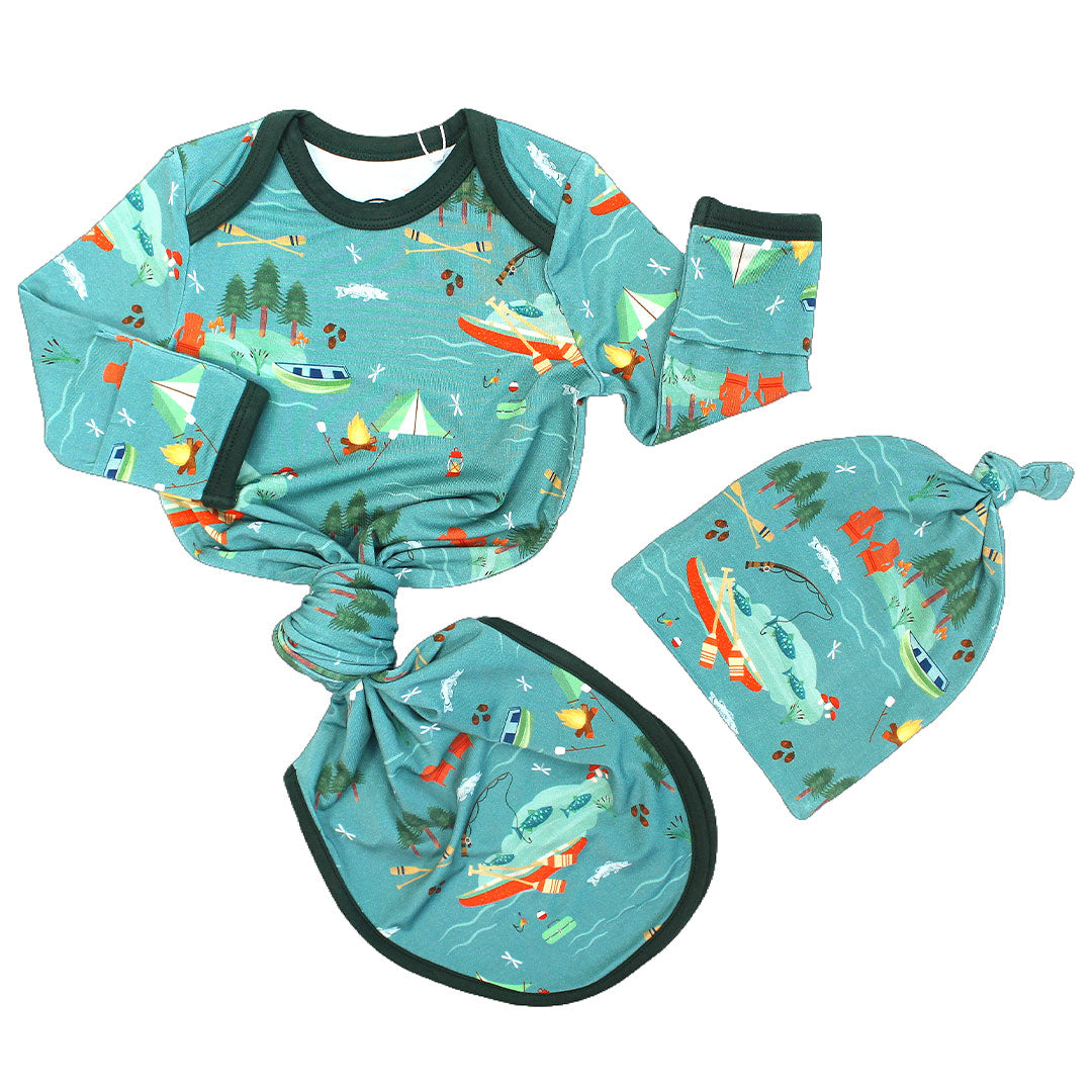 the "jump in the lake" gown and hat set. the "jump in the lake" pattern is a print to capture the day in the life on a lake. you can fine fishing poles, tents, camp fires, adirondack chairs, marsh mellows, ores, canoes, forest trees, and different types of fish and fishing gear.