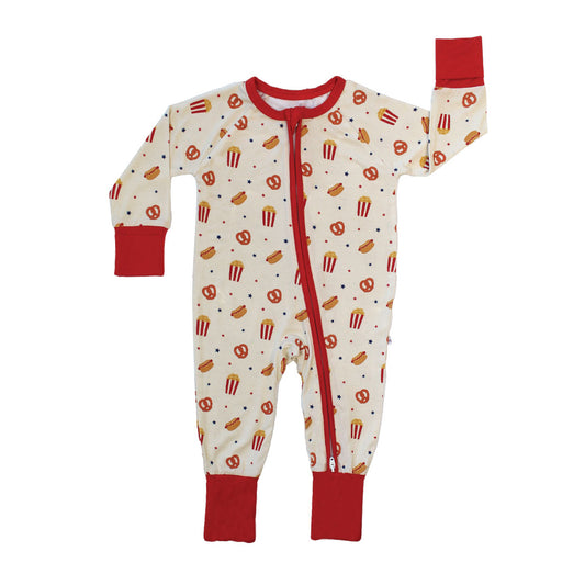 the "here for the snacks" bamboo convertible onesie. the "here for the snacks" print has a variation of pretzels, hotdogs, popcorn, and blue and red stars scattered around a beige background. 