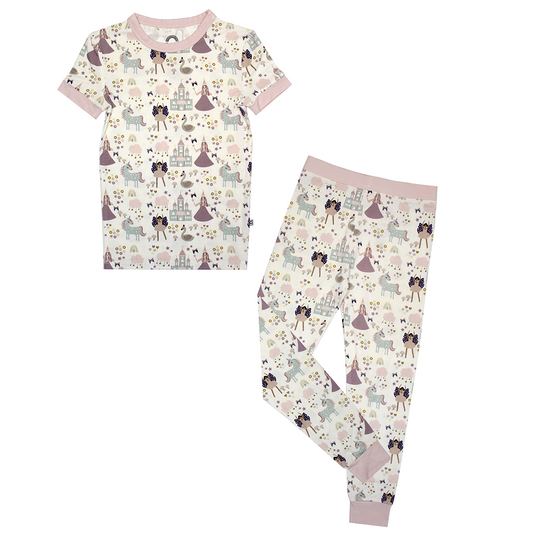 the "once upon a time" matching pajama set. the "once upon a time" print is a mix of pinks, purples, whites, blues, and yellows. you can see fairy princess and regular princess, unicorns, swans, and castles. theres also hearts, stars and sparkles scattered around the print. 