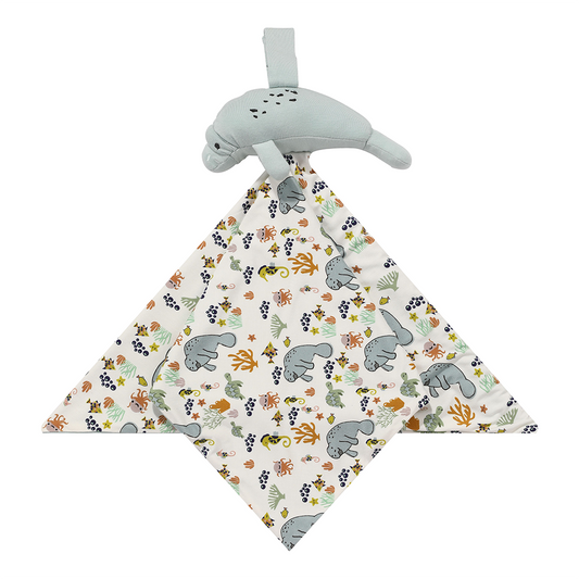 the "manatee" lovey is a blanket with the "manatee" print and a manatee attached to the top of it. the print "manatee" unites the florida sea life in a majestic print. there is a variation of florida manatees, yellow and pink sea horses, yellow and pink starfish, bubbles, turtles, and coral patterned across a white background