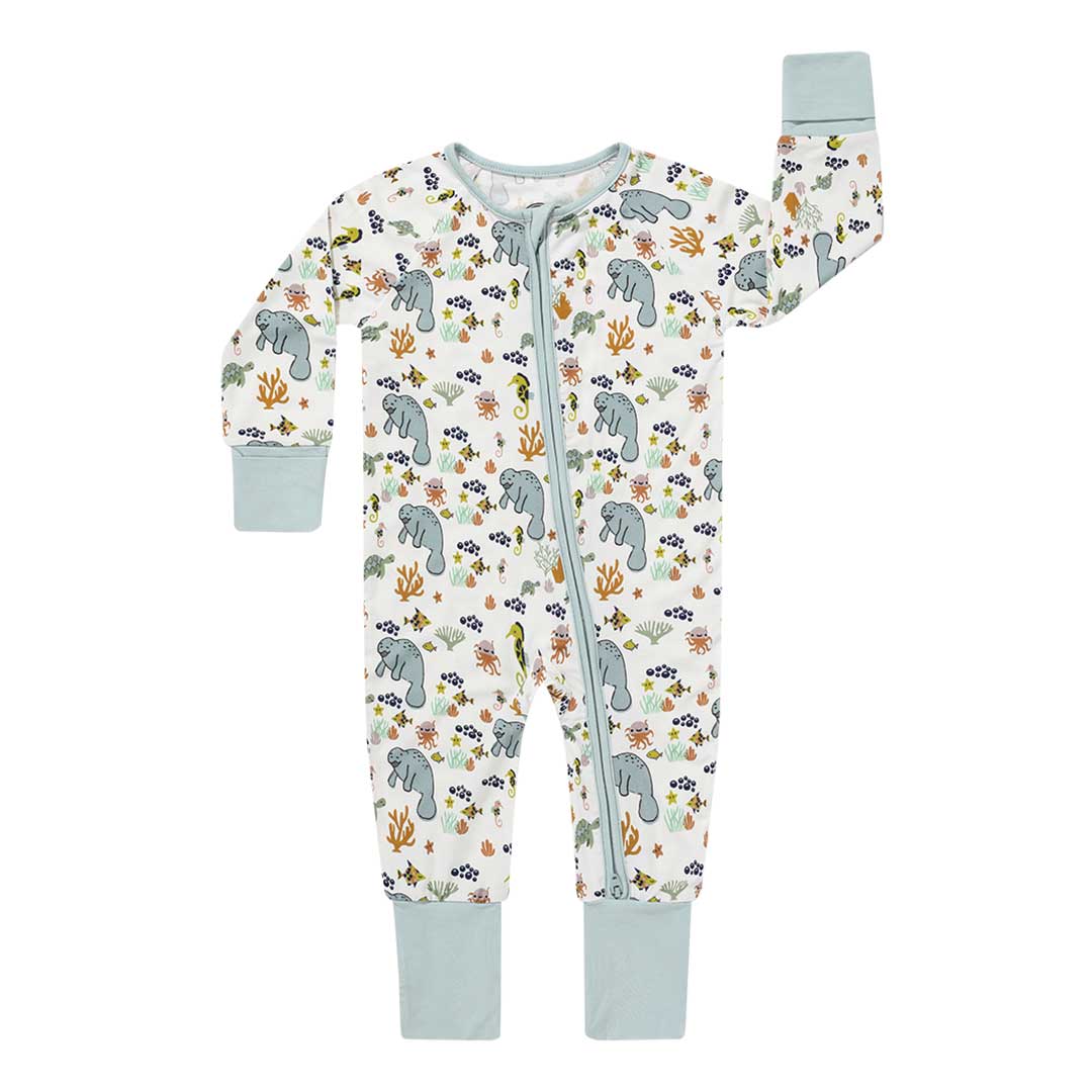 the "manatee" convertible. the print "manatee" unites the florida sea life in a majestic print. there is a variation of florida manatees, yellow and pink sea horses, yellow and pink starfish, bubbles, turtles, and coral patterned across a white background