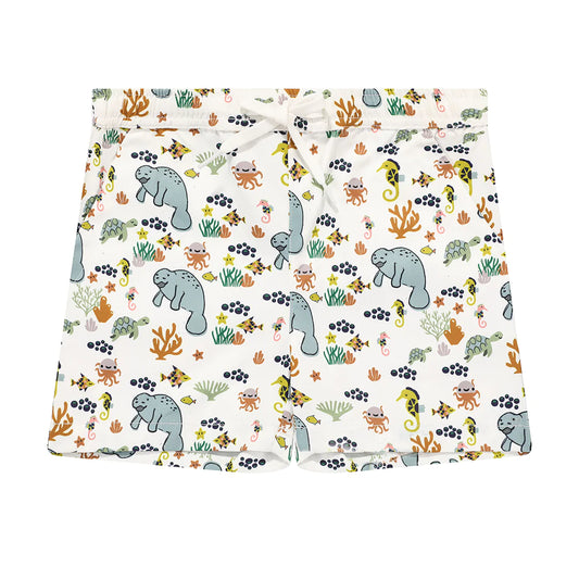 the "manatee" boy swim trunks. the print "manatee" unites the florida sea life in a majestic print. there is a variation of florida manatees, yellow and pink sea horses, yellow and pink starfish, bubbles, turtles, and coral patterned across a white background