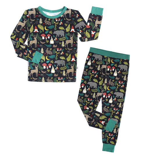 the "night forest" two-piece matching pajama set. the "night forest" print is a night time themed design. you can see an array of forest animals ranging from, deer, bears, bunnies, birds, forest trees and leaves, flowers, and mushrooms. there are also starts and moons scattered around to enhance the night time atmosphere. 