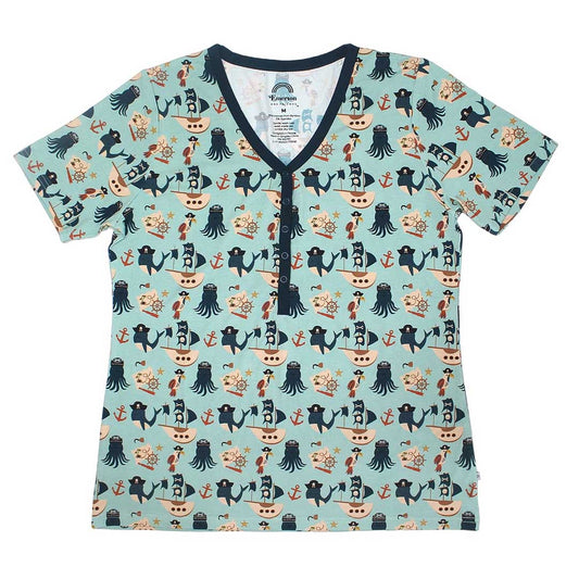 the "pirate's life" women's top. the "pirate's life" print is a mix of octopus, whales, and seagulls all wearing pirate hats. there are also anchors, pirate ships, treasure maps, and starfish mixed into the pattern. this is all displayed on a teal background. 