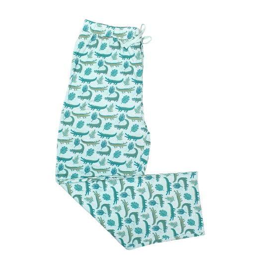 the "later gator" relaxed pants. the "later gator" print has a mix of light and dark green alligators, leaves, and white dots scattered on a teal colored background. 