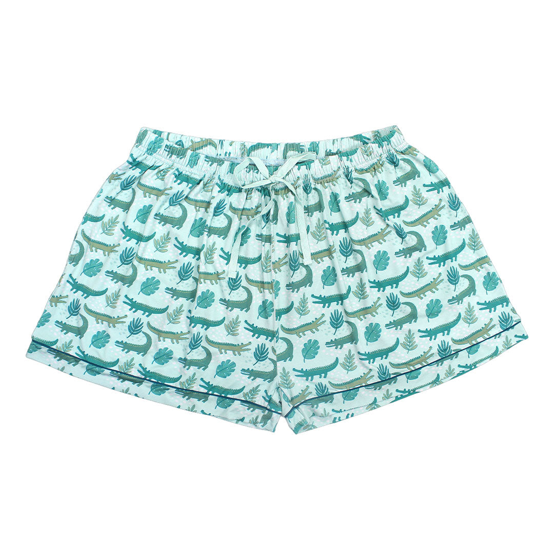 the "later gator" women's bamboo pajama shorts. the "later gator" print has a mix of light and dark green alligators, leaves, and white dots scattered on a teal colored background. 