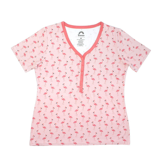 the "fancy flamingos" women's top. the "fancy flamingos" print is a pattern of multiple pink flamingoes scattered around the print. 