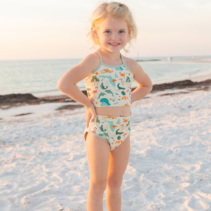 Full view of a girl in the Explore Florida bikini set, which offers UPF 50+ protection for all-day beach play.