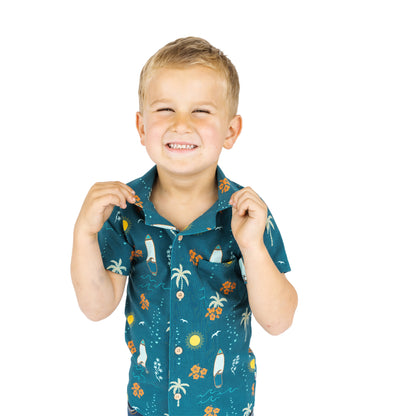 Child wearing Surf’s Up button down shirt smiling