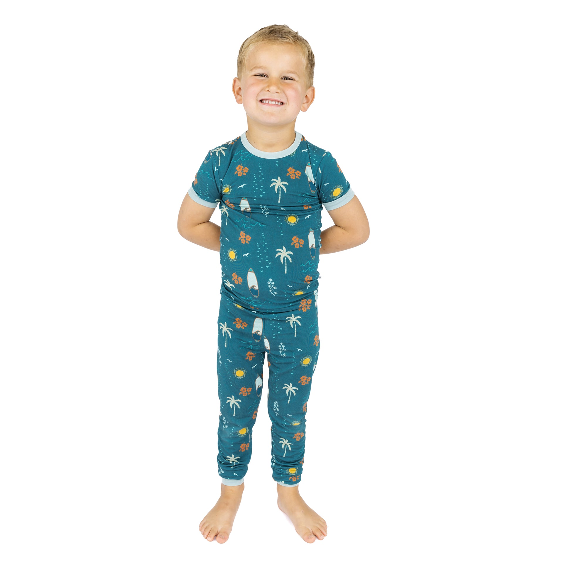 Child wearing Surf’s Up bamboo pajamas standing