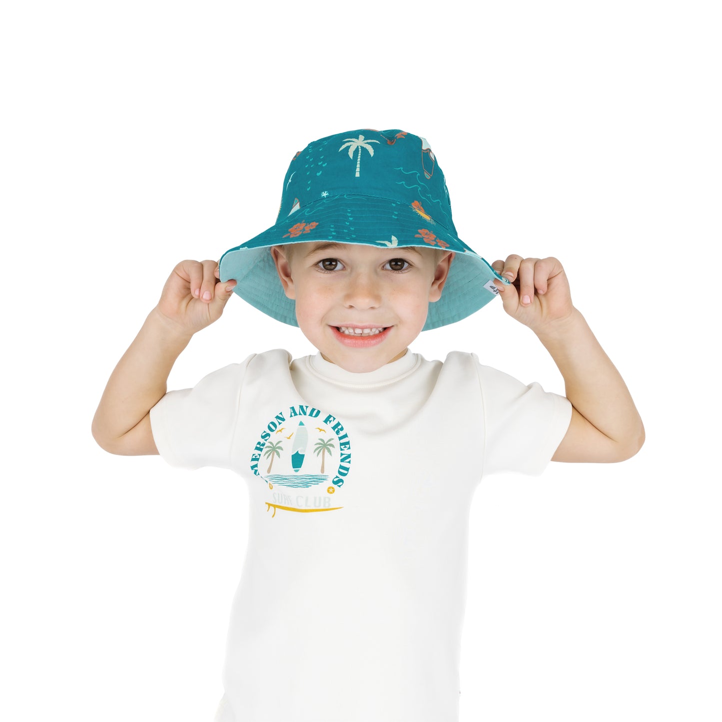 Child wearing Surf’s Up bucket hat smiling