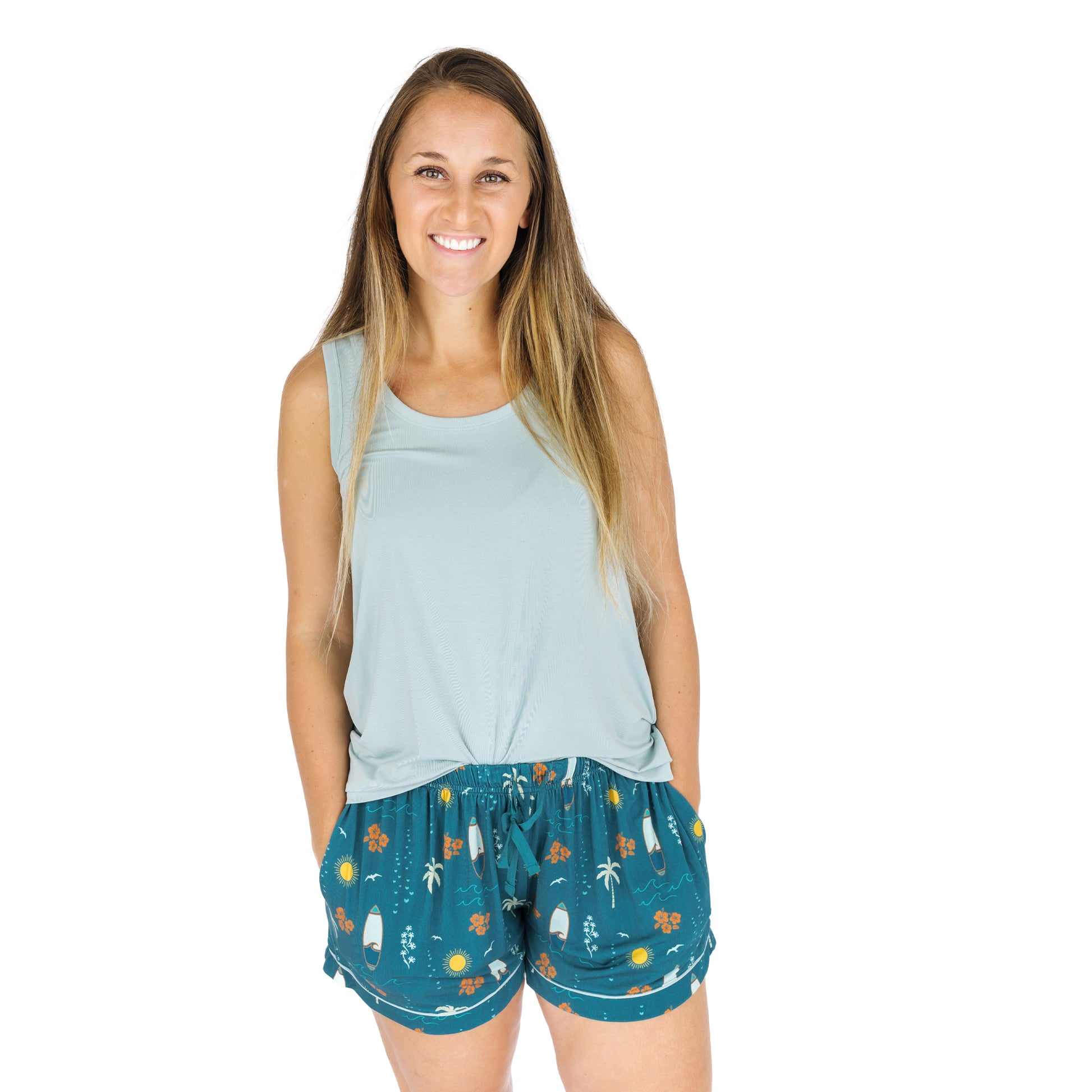 Woman wearing Surf’s Up bamboo pajama shorts with tank top